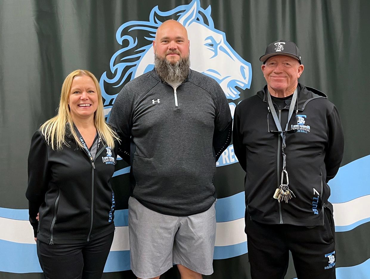 Ryan Mills, center, was introduced as Lake Region's new head football coach on Friday by principal Mary Jo Costine, left, and athletic director Bill Bullock.