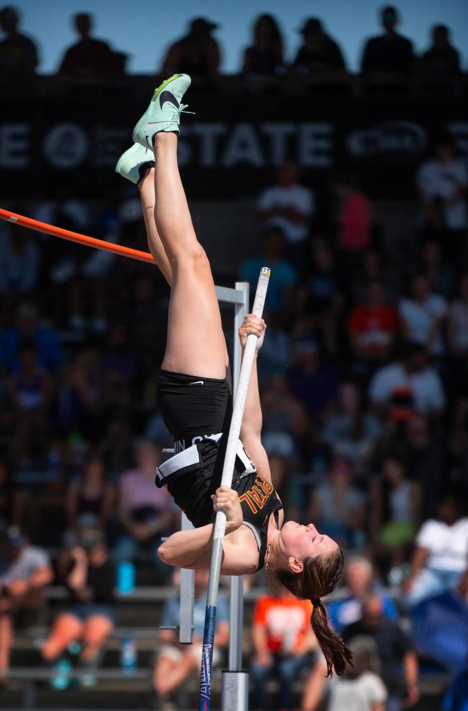 Capital’s Hana Moll goes up and over the bar en route to a a state title and new meet record of 14’ 7” during the second day of the WIAA state track and field championships at Mount Tahoma High School in Tacoma, Washington, on Friday, May 26, 2023.