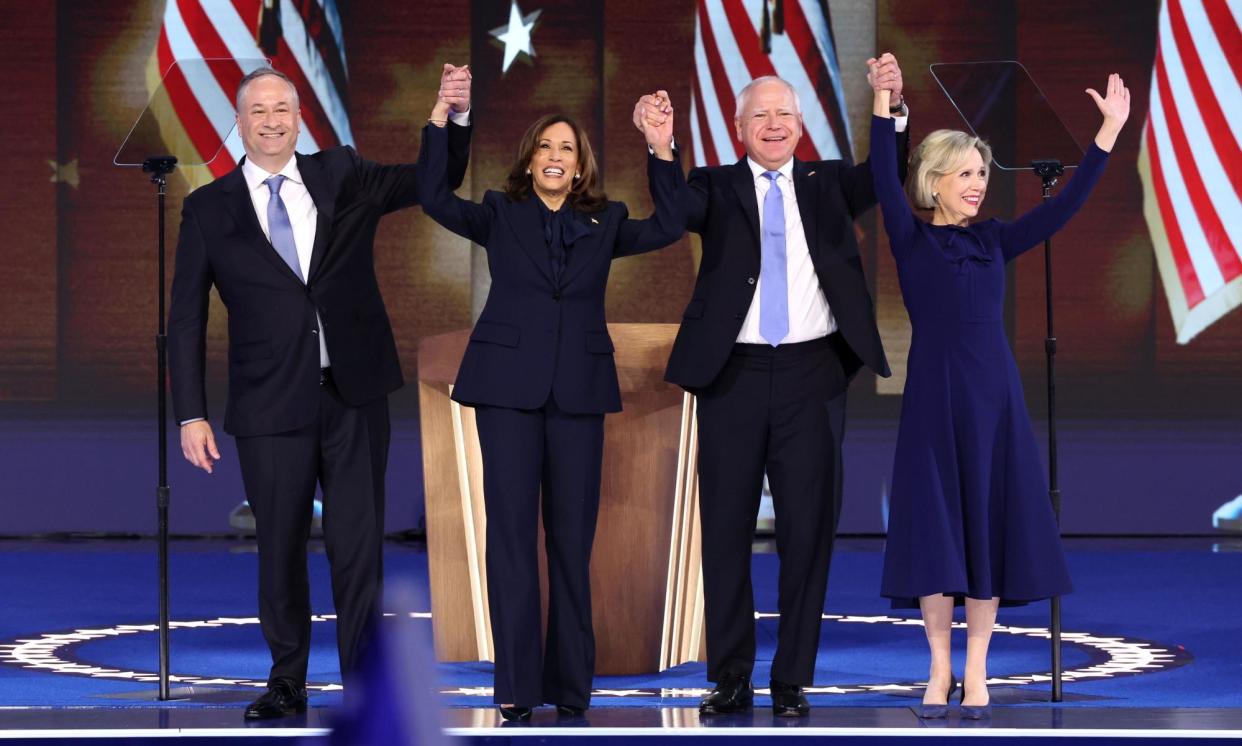 <span>Kamala Harris on stage with her husband, Doug Emhoff, and her running mate, Tim Walz, and his wife, Gwen Walz.</span><span>Photograph: Michael Reynolds/EPA</span>