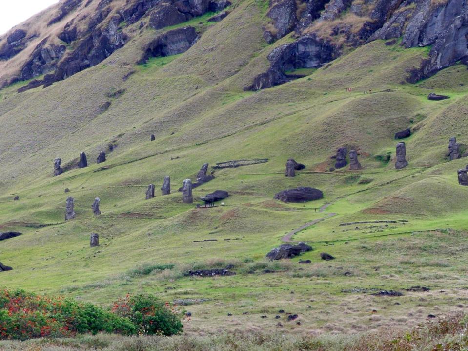 Giant stone statues on the outer slopes of Easter Island’s volcanic crater (Wikimedia Commons)