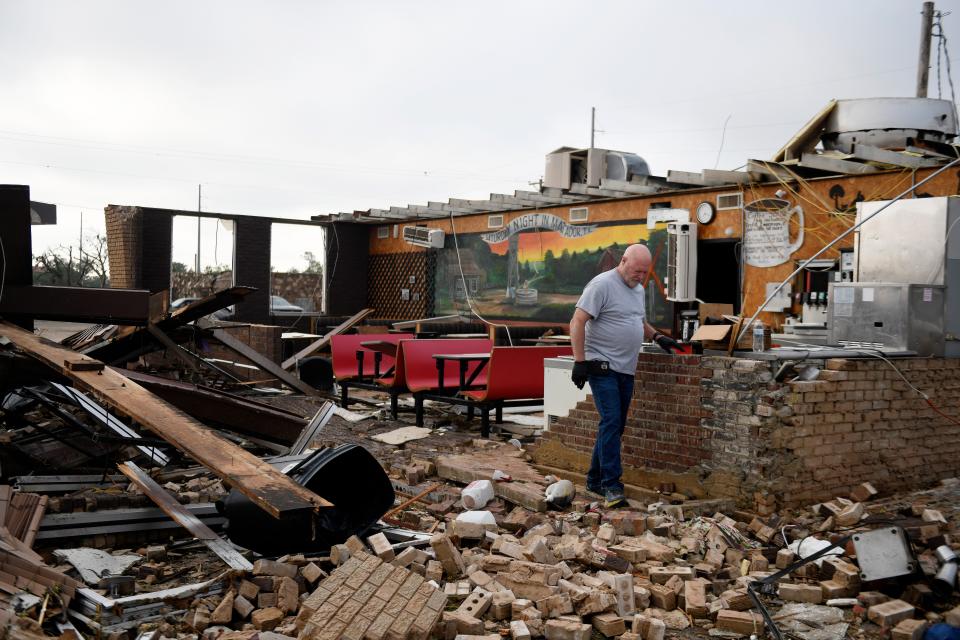 Pat Smith looks through his restaurant, Matador Diner, after a tornado,June 22, 2023, in Matador, Texas. Smith was in the cafe during the tornado and said it felt like forever but only lasted 20 seconds.