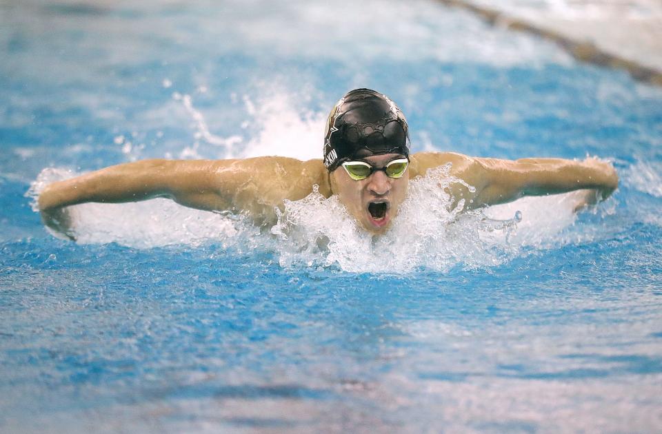 Stow's Jacob Hickin swims the butterfly portion of the 200 yard medley relay in the Suburban League National Conference Championships on Saturday, Jan. 7, 2023 in Akron, Ohio, at Ocasek Natatorium.