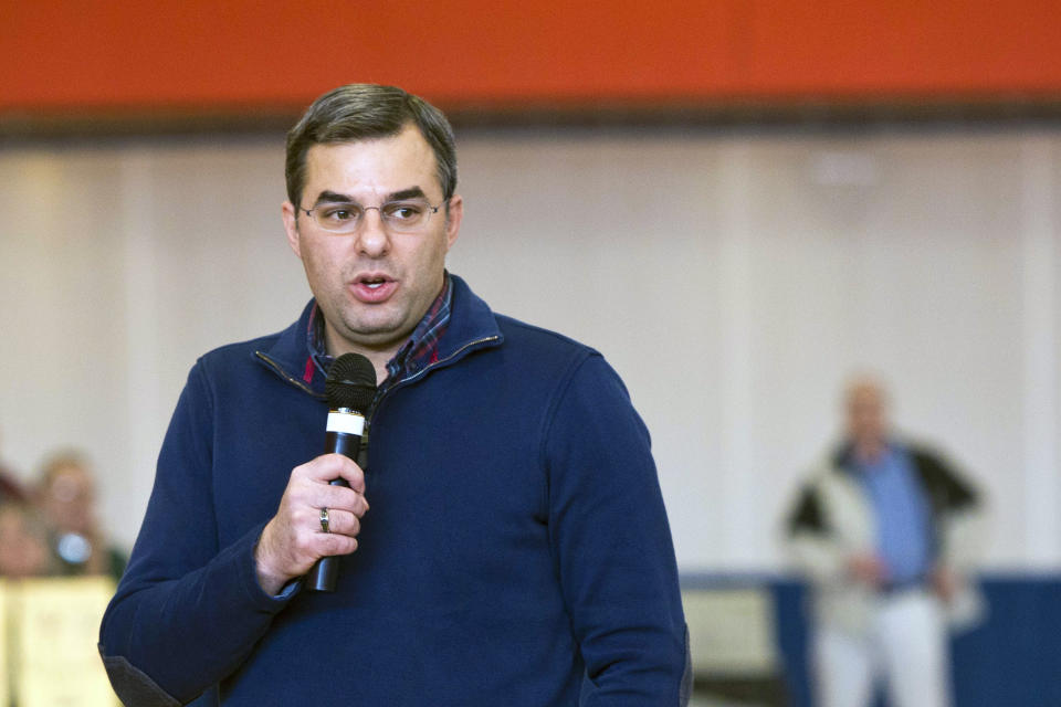 FILE - In this Thursday, Feb. 23, 2017 file photo, U.S Rep. Justin Amash, R-Cascade Township, speaks to the audience during a town hall meeting at the Full Blast Recreation Center in Battle Creek, Mich. Amash, a Republican congressman from Michigan says he’s concluded that President Donald Trump has “engaged in impeachable conduct.” Congressman Justin Amash tweeted Saturday, May 18, 2019 that he has read the entire redacted version of special counsel Robert Mueller’s Russia report. (Carly Geraci//Kalamazoo Gazette via AP, File)