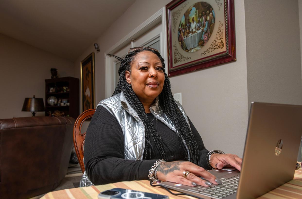 Diyawn Caldwell, founder and president of Both Sides of the Wall and organizer of the Alabama Prison Strike, works on her computer at her home in Pensacola, Florida, on Jan. 8. Her husband is in an Alabama prison.