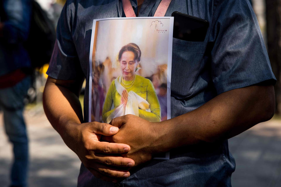 Image: A protester holds an image of Aung San Suu Kyi outside the United Nations building in Bangkok (Jack Taylor / AFP - Getty Images)