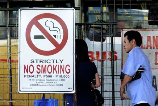 A no smoking sign is seen at a bus terminal in Manila on July 1. Anti-smoking measures have become so widespread that they now affect some 3.8 billion people -- just over half the world's population, the World Health Organization said Thursday