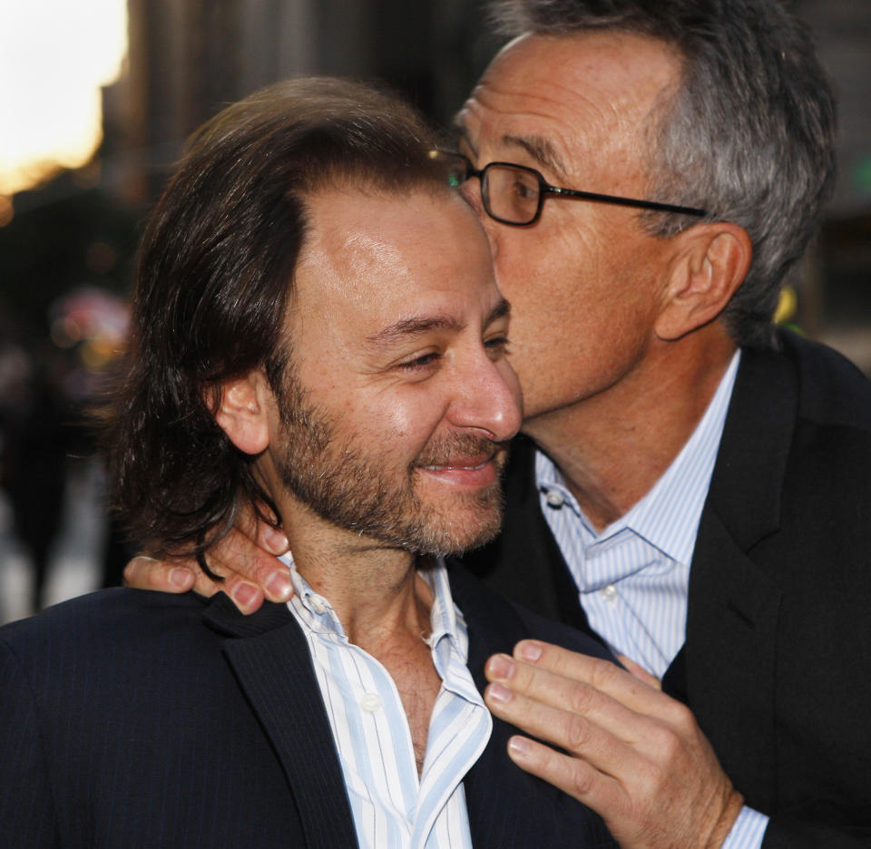 US actor Fisher Stevens (L) is greeted by a friend as he arrives for a screening of 