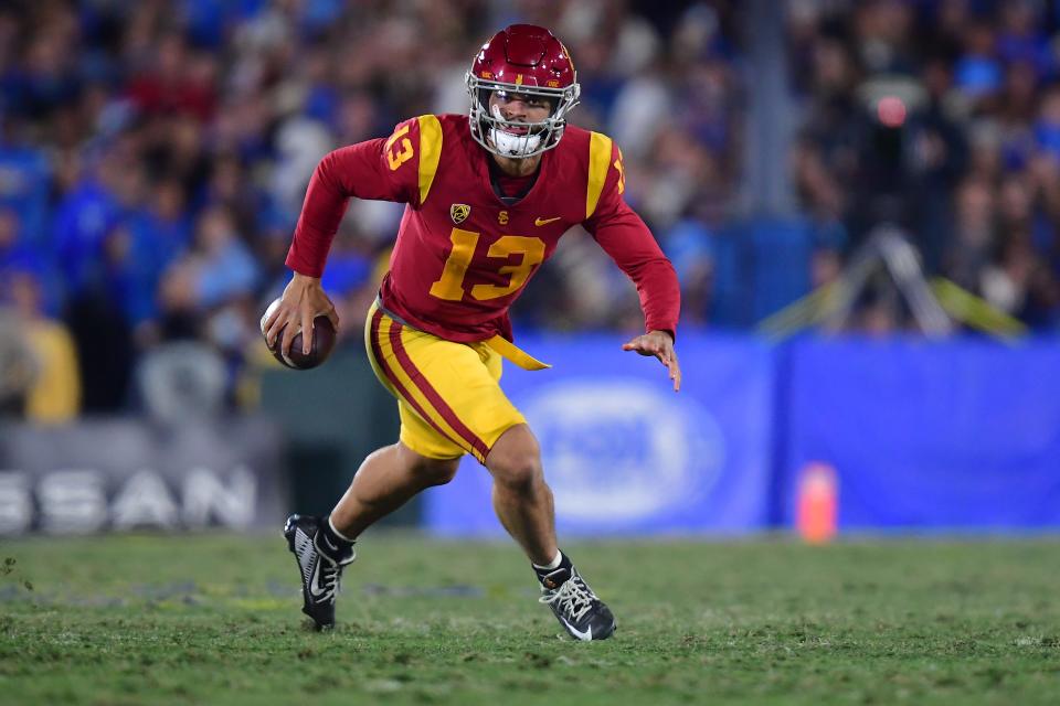 Nov 19, 2022; Pasadena, California, USA; Southern California Trojans quarterback Caleb Williams (13) runs the ball against the UCLA Bruins during the second half at the Rose Bowl. Mandatory Credit: Gary A. Vasquez-USA TODAY Sports