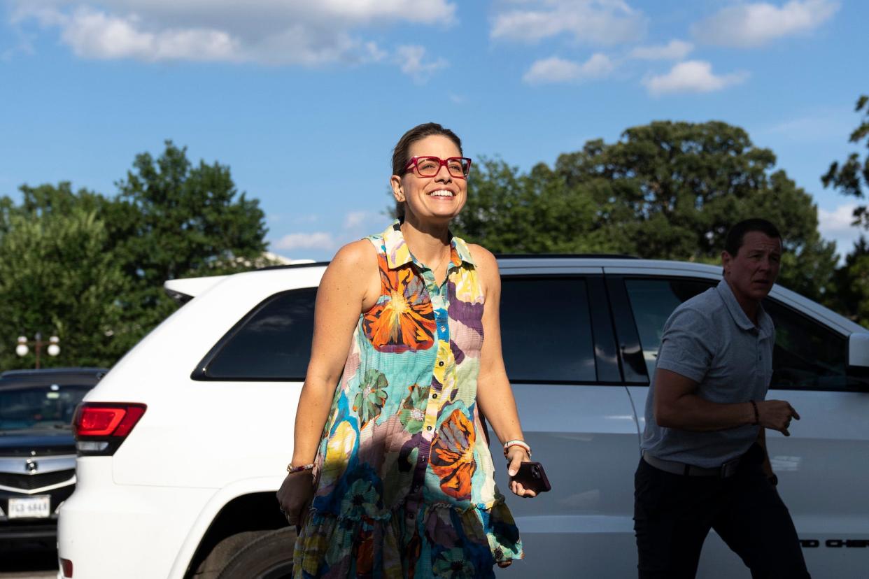 Democratic Sen. Kyrsten Sinema of Arizona and one of her staffers arrive at the US Capitol for a vote on August 1, 2022 in Washington, DC.