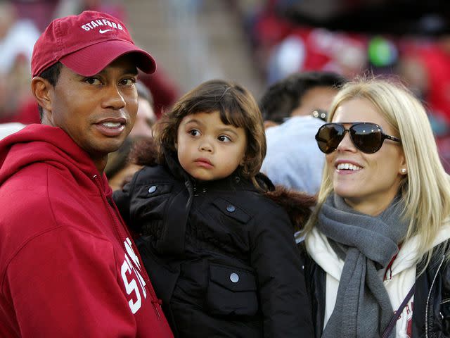 <p>Ezra Shaw/Getty</p> Tiger Woods and Elin Nordegren with their daughter Sam Woods on the sidelines before the Cardinal game against the California Bears at Stanford Stadium on November 21, 2009.