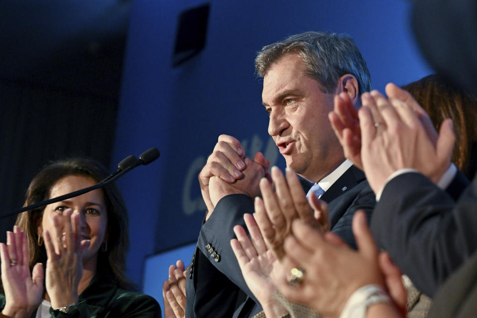 Markus Soder, CSU top candidate and Minister President of Bavaria, receives applauses at the election party after the announcement of the first forecast for the state election in Bavaria, in Munich, Germany, Sunday, Oct. 8, 2023.. The election for the 19th Bavarian state parliament took place in Bavaria on Sunday. (Peter Kneffel/dpa via AP)