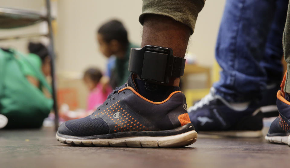 <span class="s1">A Honduras immigrant seeking asylum, Carlos Fuentes Maldonado, who was released and reunited with his family, wears an ankle monitor as he waits at a Catholic Charities facility in San Antonio on Monday. (Photo: Eric Gay/AP)</span>