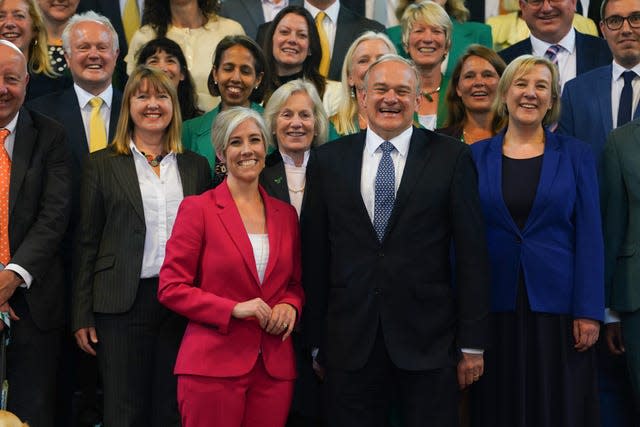 Sir Ed and Daisy Cooper, front and centre of the Lib Dem group at Westminster