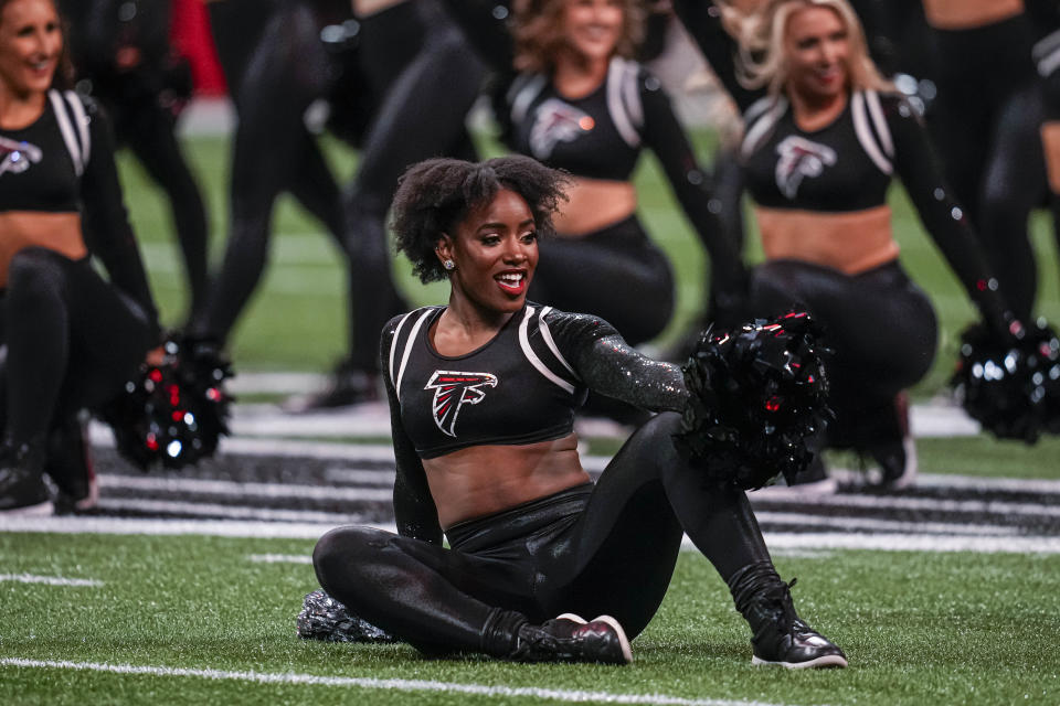 Nov 26, 2023; Atlanta, Georgia, USA; An Atlanta Falcons cheerleader on the field against the New Orleans Saints at Mercedes-Benz Stadium. Mandatory Credit: Dale Zanine-USA TODAY Sports