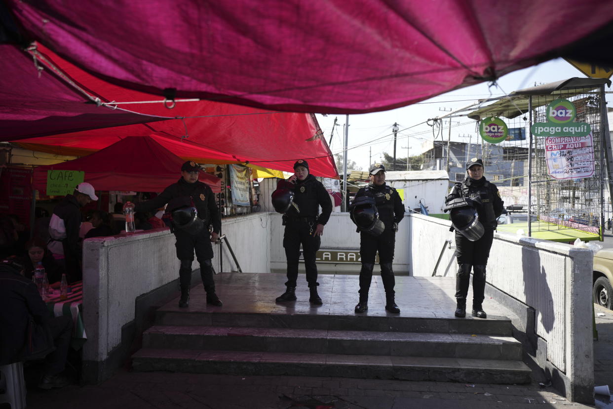 Police secure an area outside the Raza station where two subway trains collided, in Mexico City, Saturday, Jan. 7, 2023. Authorities announced at least one person was killed and dozens were injured in the Saturday accident on Line 3 of the capital's subway. (AP Photo/Fernando Llano)