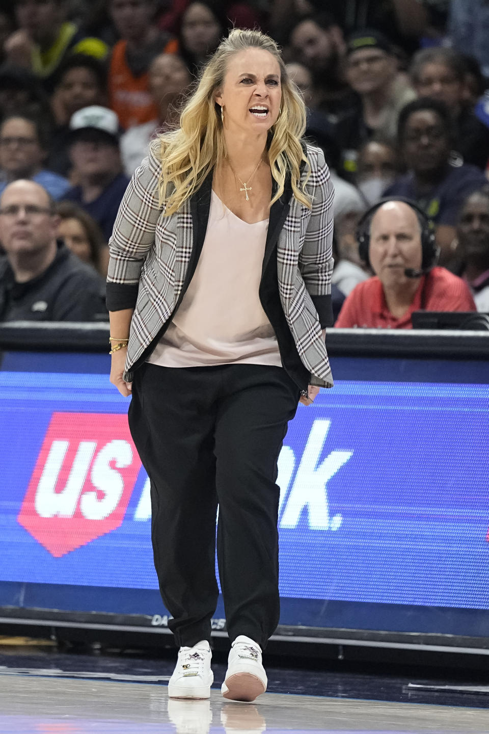 Las Vegas Aces head coach Becky Hammon gives instructions to the team during the second half of Game 3 of a WNBA basketball playoffs semifinal against the Dallas Wings, Friday, Sept. 29, 2023, in Arlington, Texas. (AP Photo/Sam Hodde)