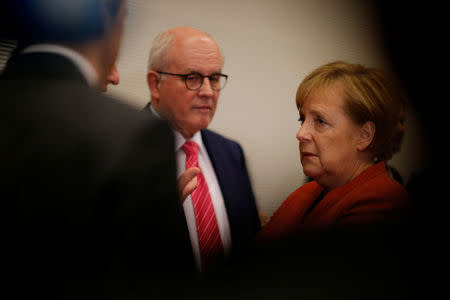 German Chancellor Angela Merkel and CDU/CSU parliamentary group chair Volker Kauder attend a meeting at the Bundestag in Berlin, Germany, November 20, 2017. REUTERS/Axel Schmidt