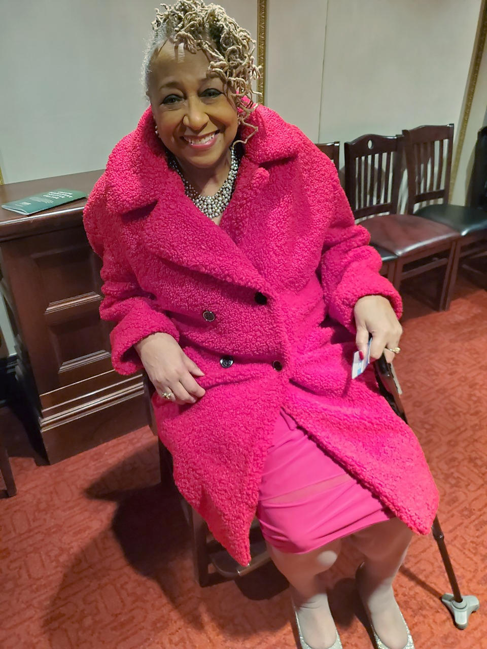 In this March 7, 2020, photo provided by Marsha Battle Philpot, Brenda Perryman, sits at a Detroit Symphony Orchestra performance at the Max M. and Marjorie S. Fisher Music Center, in Detroit. As the coronavirus tightens its grip across the country, it is cutting a particularly devastating swath through an already vulnerable population, black Americans. In Detroit, the deaths include Gloria Smith, a fixture at the city’s African World Festival, who died within a week of her husband, and educator and playwright Perryman. (Marsha Battle Philpot, aka Marsha Music via AP)