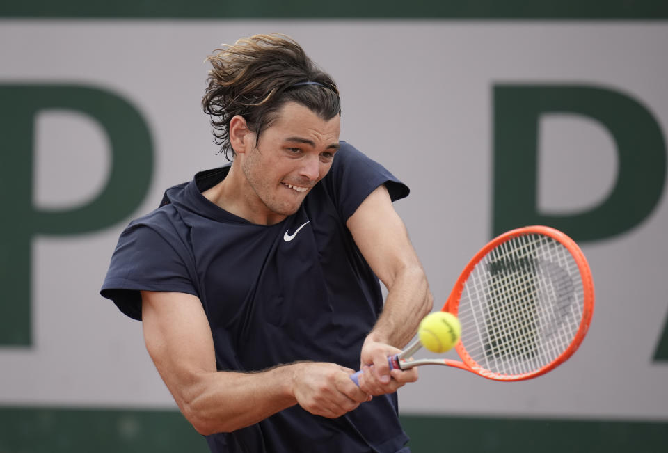 United States's Taylor Fritz plays a return to Germany's Dominik Koepfer during their second round match on day 5, of the French Open tennis tournament at Roland Garros in Paris, France, Thursday, June 3, 2021. (AP Photo/Christophe Ena)