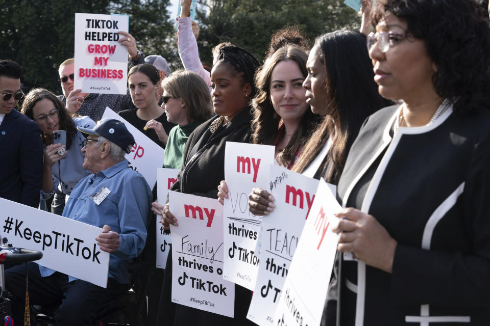 Supporters of TikTok hold signs during a rally to defend the app at the Capitol (Jose Luis Magana / AP file)