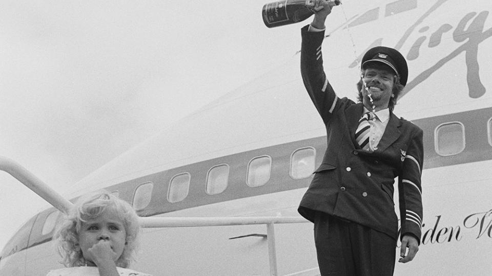 Branson inaugurates his new airline Virgin Atlantic Airways on the steps of the ‘Maiden Voyager’ in 1984. - Credit: Terry Disney