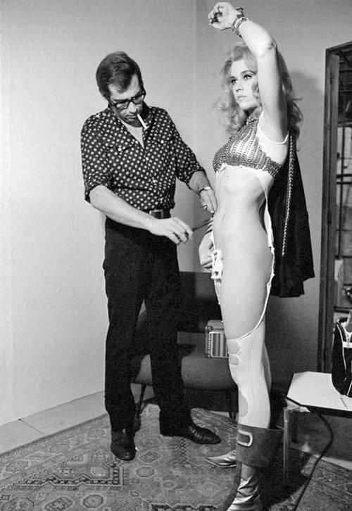 <p>Roger Vadim puts the finishing touches to one of Jane Fonda’s revealing outfits.</p>