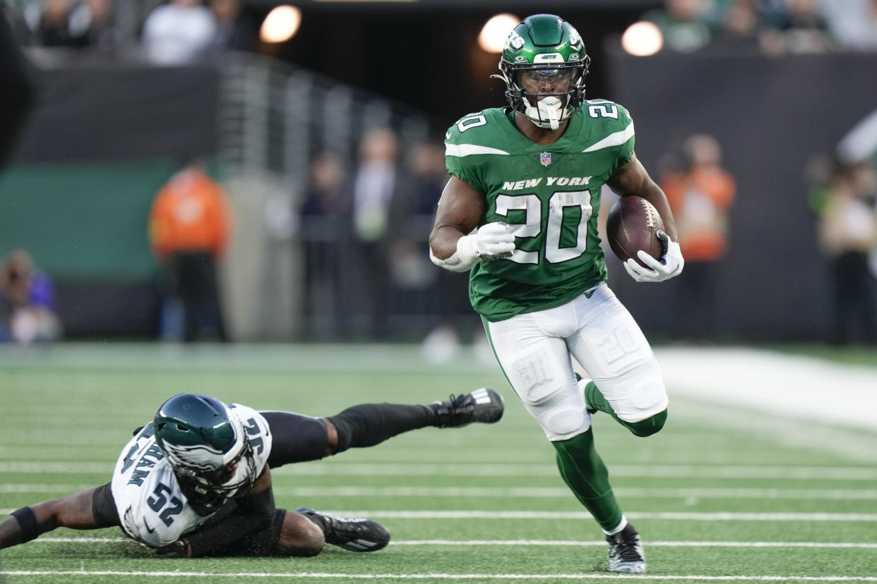 Breece Hall scored a late touchdown after New York intercepted Jalen Hurts and the Jets beat the Eagles for the first time in franchise history. (AP Photo/Bryan Woolston)