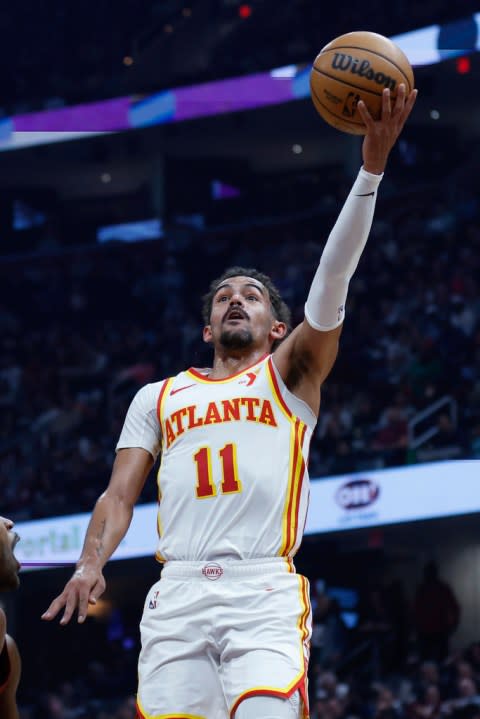 Atlanta Hawks guard Trae Young shoots against the Cleveland Cavaliers during the first half of an NBA basketball game, Saturday, Dec. 16, 2023, in Cleveland. (AP Photo/Ron Schwane)