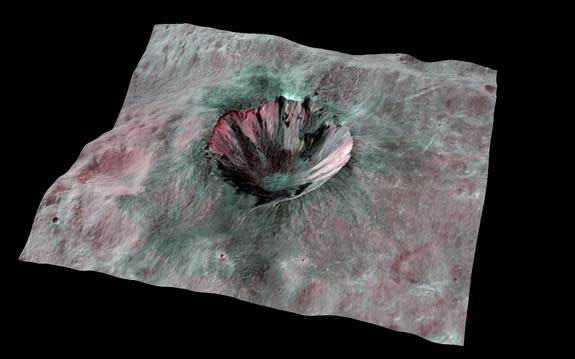 This composite-color view from NASA's Dawn mission shows Cornelia Crater, streaked with dark materials, on the giant asteroid Vesta