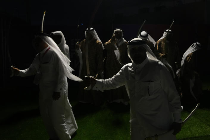 Dancers perform at a fan zone ahead of the FIFA World Cup, in Doha, Qatar Saturday, Nov. 19, 2022. (AP Photo/Petr Josek)