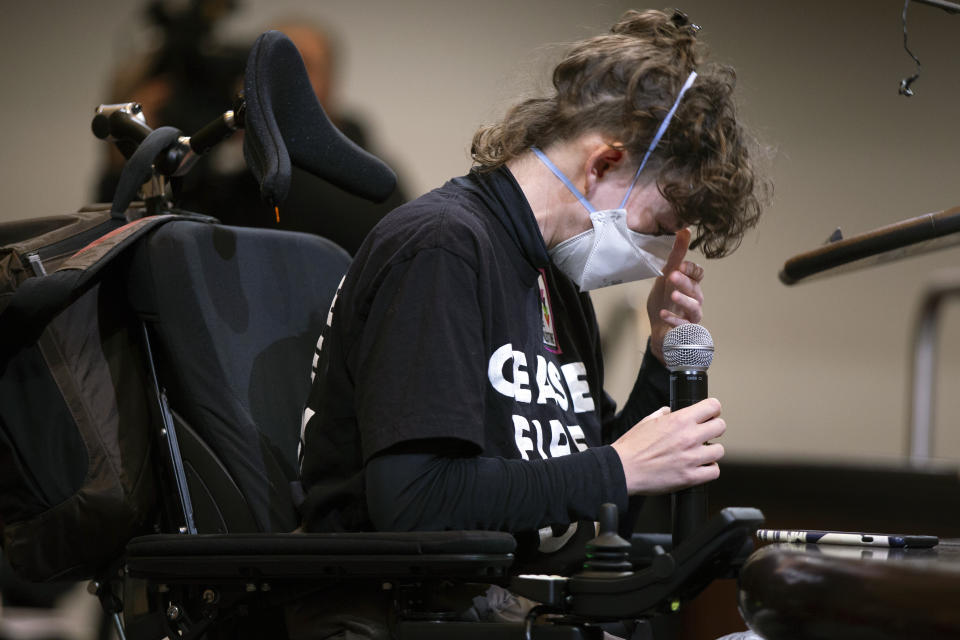 A woman is overcome with emotion as she expresses her opinions about the resolution calling for an immediate cease-fire in Gaza, Monday, Nov. 27, 2023, in Oakland, Calif. (AP Photo/D. Ross Cameron)