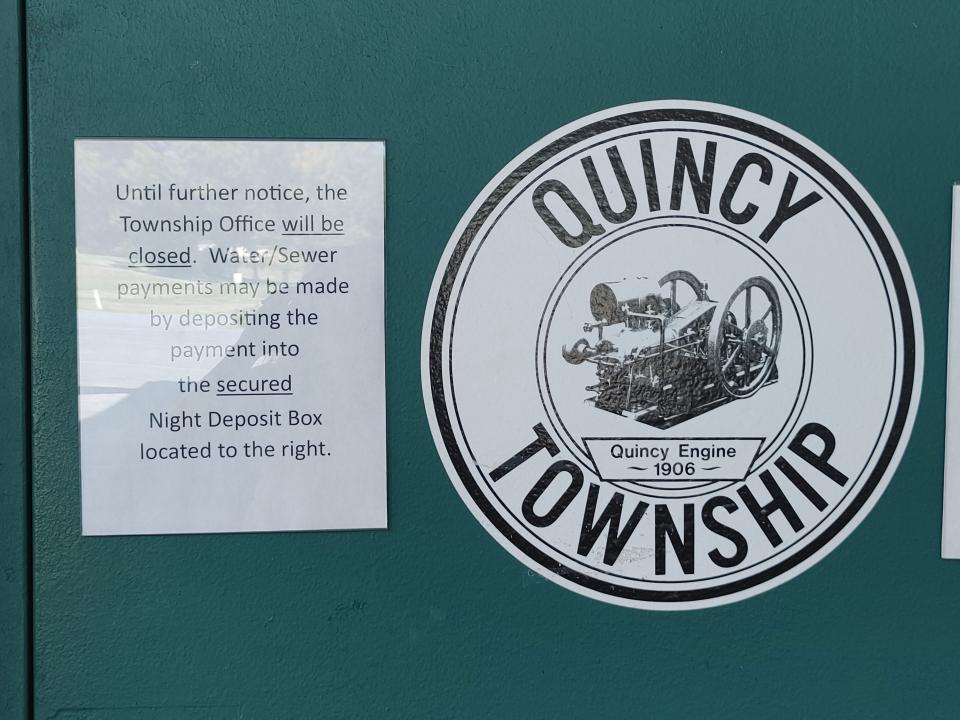 A sign on the door at the Quincy Township office tells visitors the office is closed until further notice.
