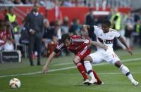 Football Soccer - FC Ingolstadt 04 v Bayern Munich - German Bundesliga - Audi Sportpark, Ingolstadt, Germany 07/05/16 Bayern Munich's Douglas Costa and FC Ingolstadt 04's Markus Suttner in action. REUTERS/Michaela Rehle.