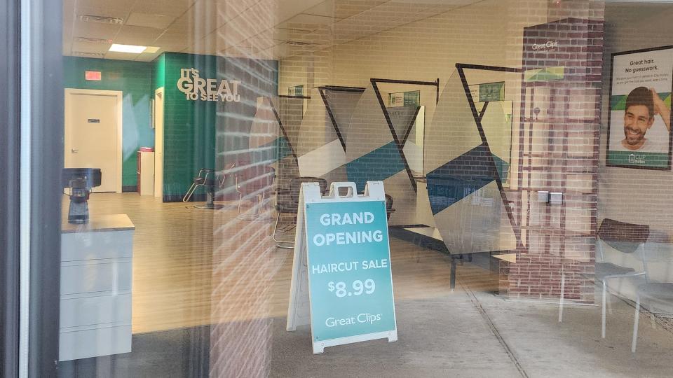 Inside of the new Great Clips with sign promoting their opening day sale