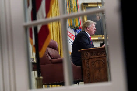 U.S. President Donald Trump delivers a televised address to the nation from his desk in the Oval Office, about immigration and the southern U.S. border, on the 18th day of a partial government shutdown at the White House in Washington, U.S., January 8, 2019. REUTERS/Joshua Roberts