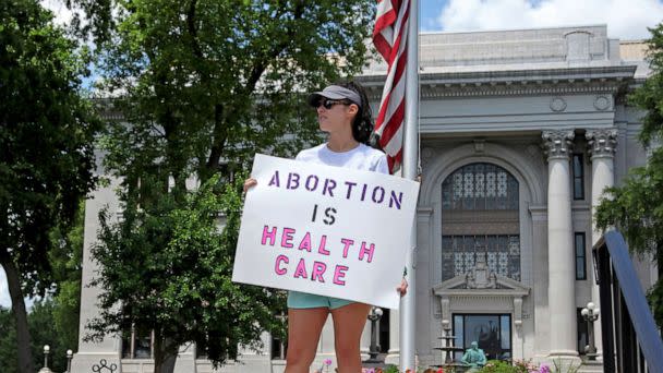 PHOTO: An abortion-rights demonstrator holds a sign in front of the Hamilton County Court House on May 14, 2022, in Chattanooga, Tenn.On June 28, a federal court  allowed Tennessee's ban on abortion as early as six weeks into pregnancy to take effect. (Ben Margot/AP, FILE)