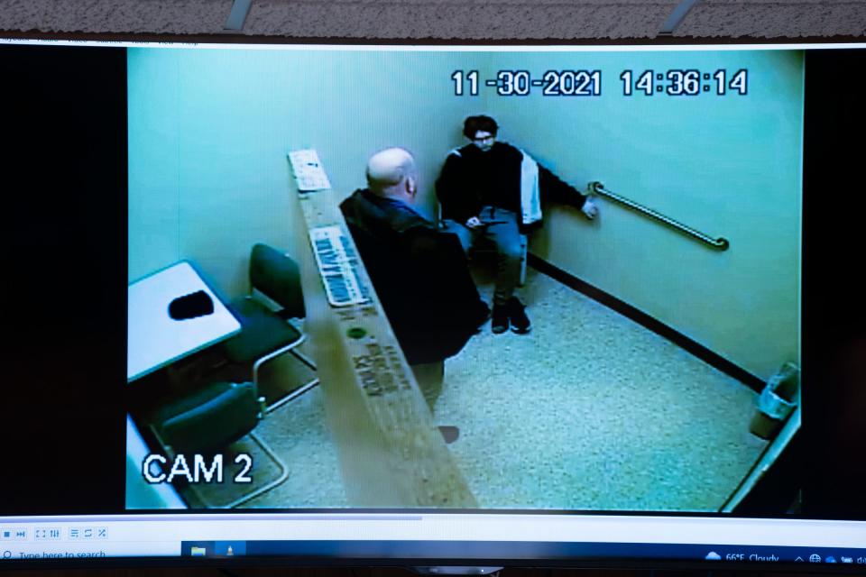 The Oakland County Prosecutors show a video of Ethan Crumbley in custody the day he carried out a school shooting at Oxford High School in the Oakland County Courtroom of Judge Kwame Rowe on Friday, Aug. 18, 2023, in Pontiac, Mich. The point of the video was to have forensic psychiatrist Lisa Anacker give her professional opinion on whether Crumbley showed signs of psychosis while in custody. She determined that he did not and also followed commands and remained quiet and calm.