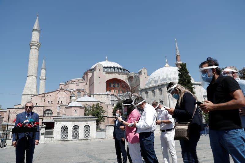 Turkish President Tayyip Erdogan talks to media after attending Friday prayers at Hagia Sophia Grand Mosque in Istanbul