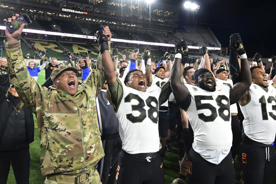 FILE - Air Force's Supt. Lt. Gen. Richard Clark, left, celebrates with the Air Force NCAA college football team after a 35-21 win against Colorado State at Canvas Stadium in Ft. Collins, Colo., Saturday, Nov. 13, 2021. Lt. Gen. Richard Clark, the superintendent of the Air Force Academy, was announced Friday, Nov. 10, 2023, as the new executive director of the College Football Playoff. ( Jerilee Bennett/The Gazette via AP, File)