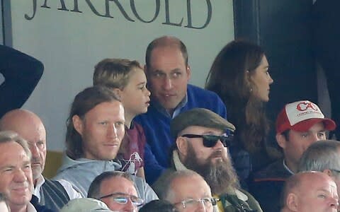 Prince George of Cambridge, Prince William, Duke of Cambridge and Catherine, Duchess of Cambridge are seen in the stands during the Premier League match between Norwich City and Aston Villa - Credit: Stephen Pond/Getty Images Europe