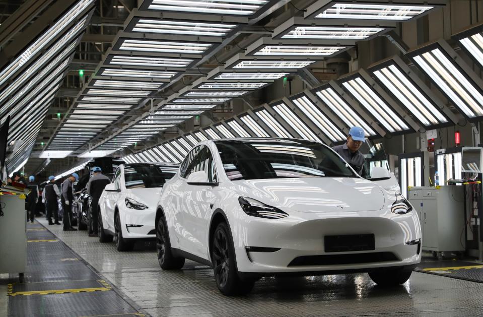 Employees work at Tesla's Shanghai Gigafactory in east China's Shanghai, Dec. 22, 2023.