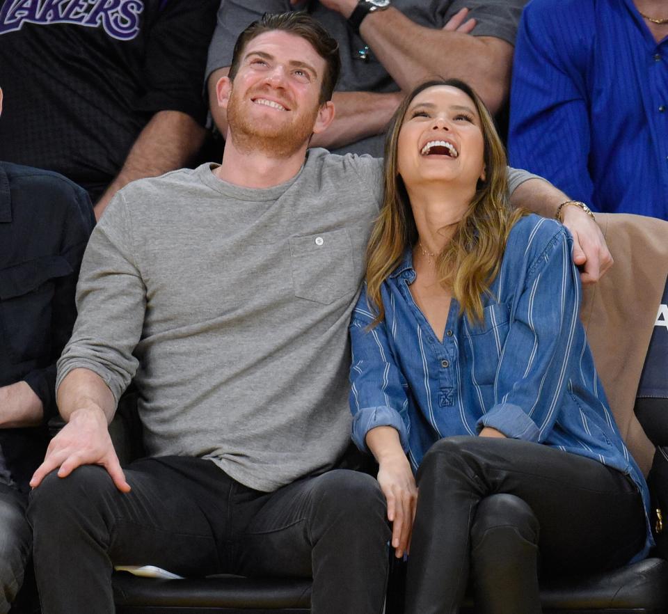 Bryan Greenberg (L) and Jamie Chung attend a basketball game between the New York Knicks and the Los Angeles Lakers at Staples Center on December 11, 2016 in Los Angeles, California