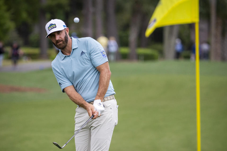 Dustin Johnson hits to the ninth green during the first round of the RBC Heritage golf tournament in Hilton Head Island, S.C., Thursday, April 15, 2021. (AP Photo/Stephen B. Morton)