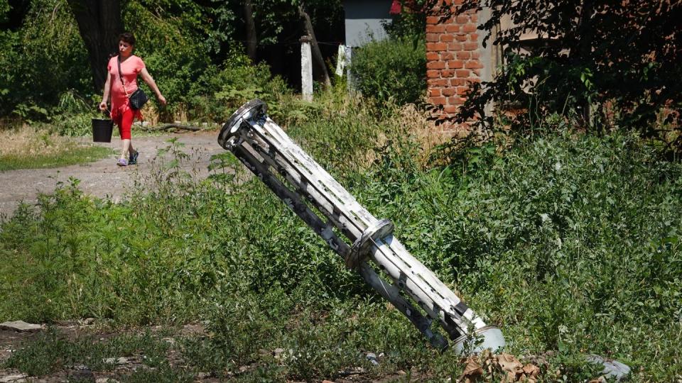 The remains of a Russian missile that dropped cluster bombs in a residential housing complex is lodged in the ground near the complex on June 27, 2022 in Sloviansk, Ukraine. (Photo by Scott Olson/Getty Images)