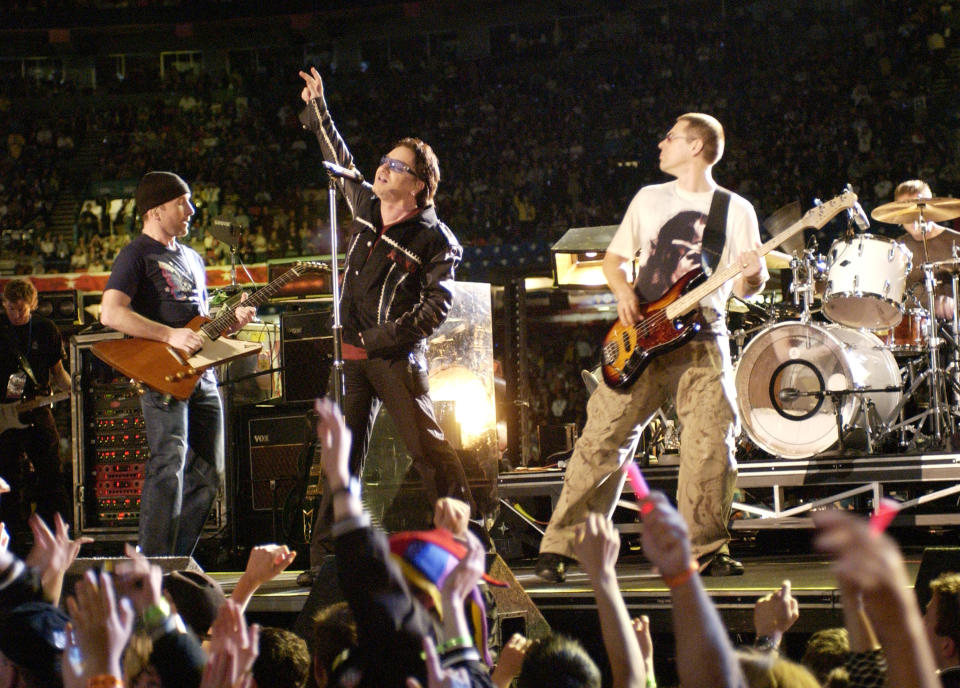 U2 performs during the halftime show at Super Bowl XXXVI in the Superdome, New Orleans, Louisiana, February 3, 2002. (Photo by KMazur/WireImage)