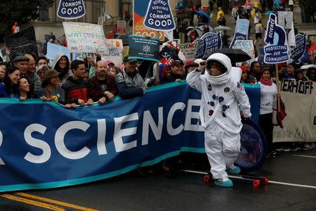 Demonstrators march to the U.S. Capitol during the March for Science in Washington, U.S., April 22, 2017. REUTERS/Aaron P. Bernstein