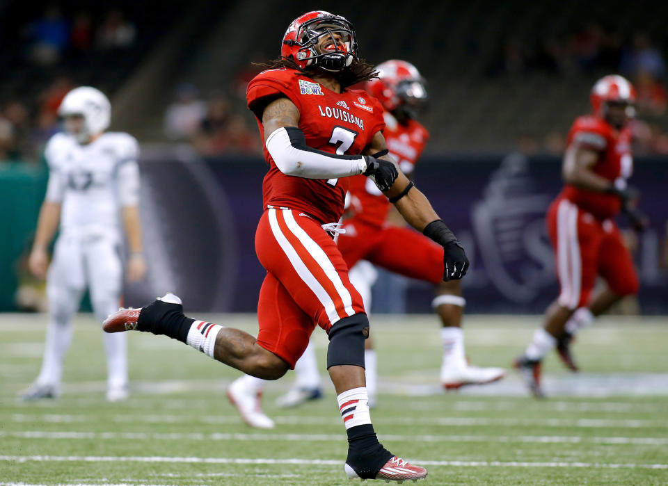 Louisiana-Lafayette cornerback Corey Trim (7) celebrates after breaking up a pass on fourth down during the second half of the New Orleans Bowl NCAA college football game against Nevada in New Orleans, Saturday, Dec. 20, 2014. Louisiana-Lafayette won 16-3. (AP Photo/Jonathan Bachman)