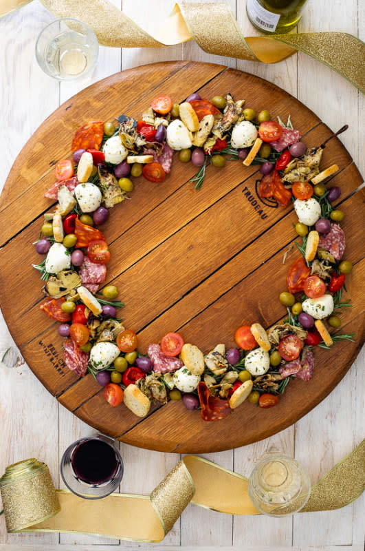 <p>courtesy of Simply Delicious Food</p><p>Simply Delicious Food's Wreath includes a variety of elements like salami, prosciutto, olives, pickled or marinated vegetables like artichokes, eggplant or mushrooms and one or two cheeses, such as Parmesan, Pecorino and marinated mozzarella.</p><p><strong>Get the Recipe: <a href="https://simply-delicious-food.com/easy-antipasto-wreath/" rel="nofollow noopener" target="_blank" data-ylk="slk:Easy Antipasto Wreath;elm:context_link;itc:0;sec:content-canvas" class="link ">Easy Antipasto Wreath</a></strong></p><p><strong>Related: <a href="https://www.yahoo.com/lifestyle/halloween-charcuterie-coffin-showstopping-easy-170359029.html" data-ylk="slk:Halloween Charcuterie Coffin;elm:context_link;itc:0;sec:content-canvas;outcm:mb_qualified_link;_E:mb_qualified_link;ct:story;" class="link  yahoo-link">Halloween Charcuterie Coffin</a></strong></p>