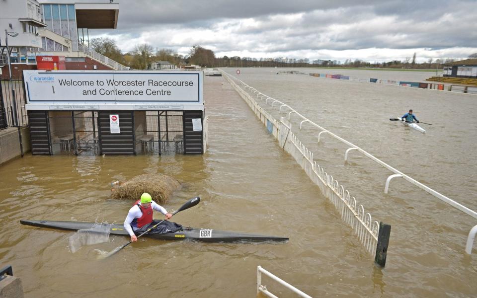 The deluge that flooded Worcester racecourse was good news only for the town's canoe club - Jacob King/PA