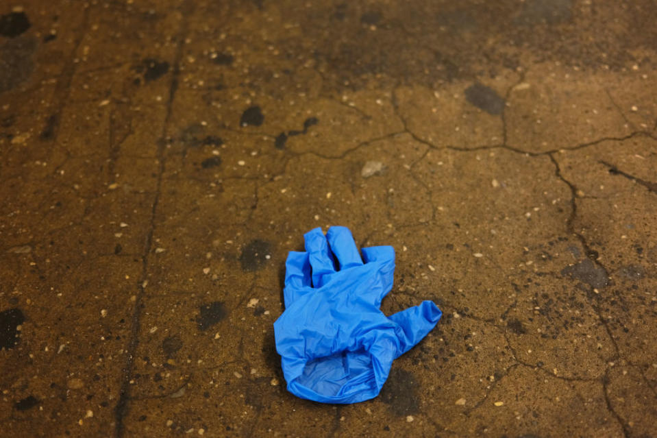 A medical glove is discarded on a subway platform during the Coronavirus outbreak. Source: Getty